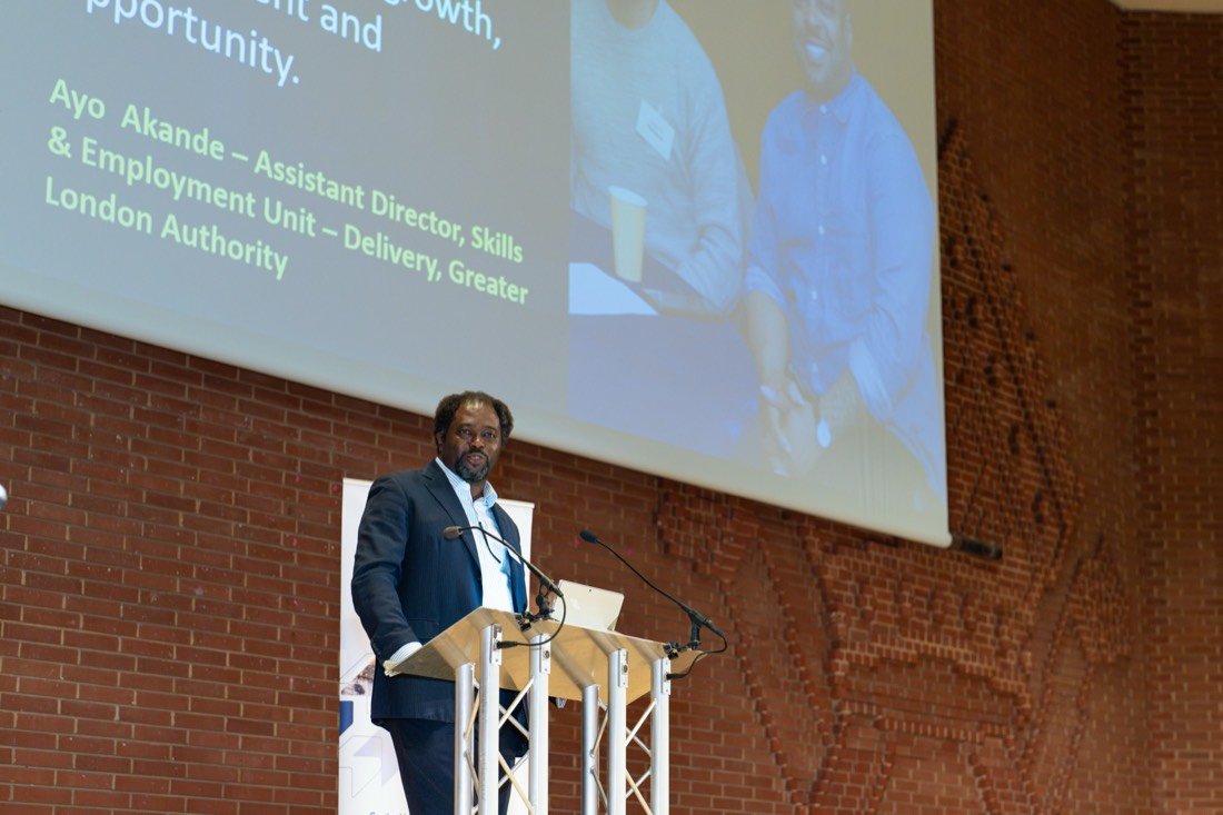 Ayo Akande speaking at Connect to Work